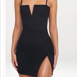 New with tag! Stunning black mini dress with thigh slit